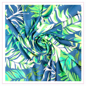 Viskose/Jersey - Blau mit Blättern in Grüntönen